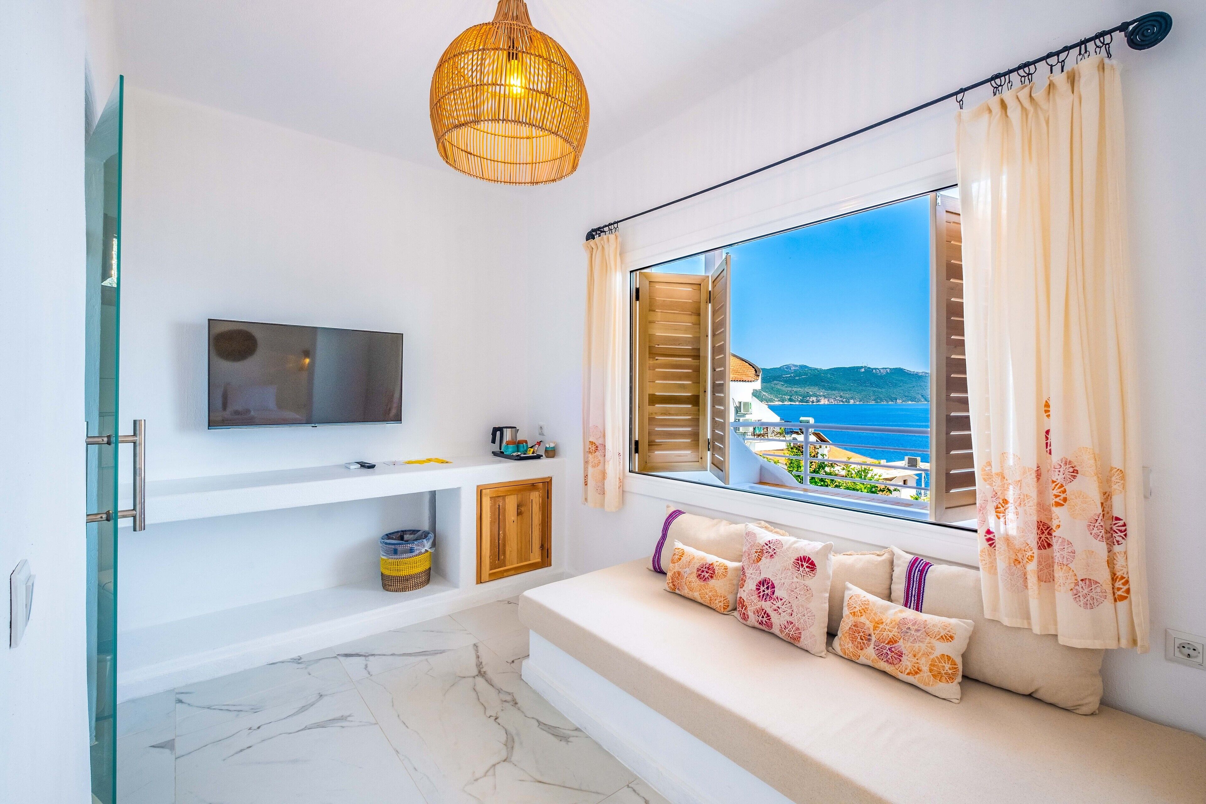 premium room with sea view & jacuzzi | living area | lcd tv