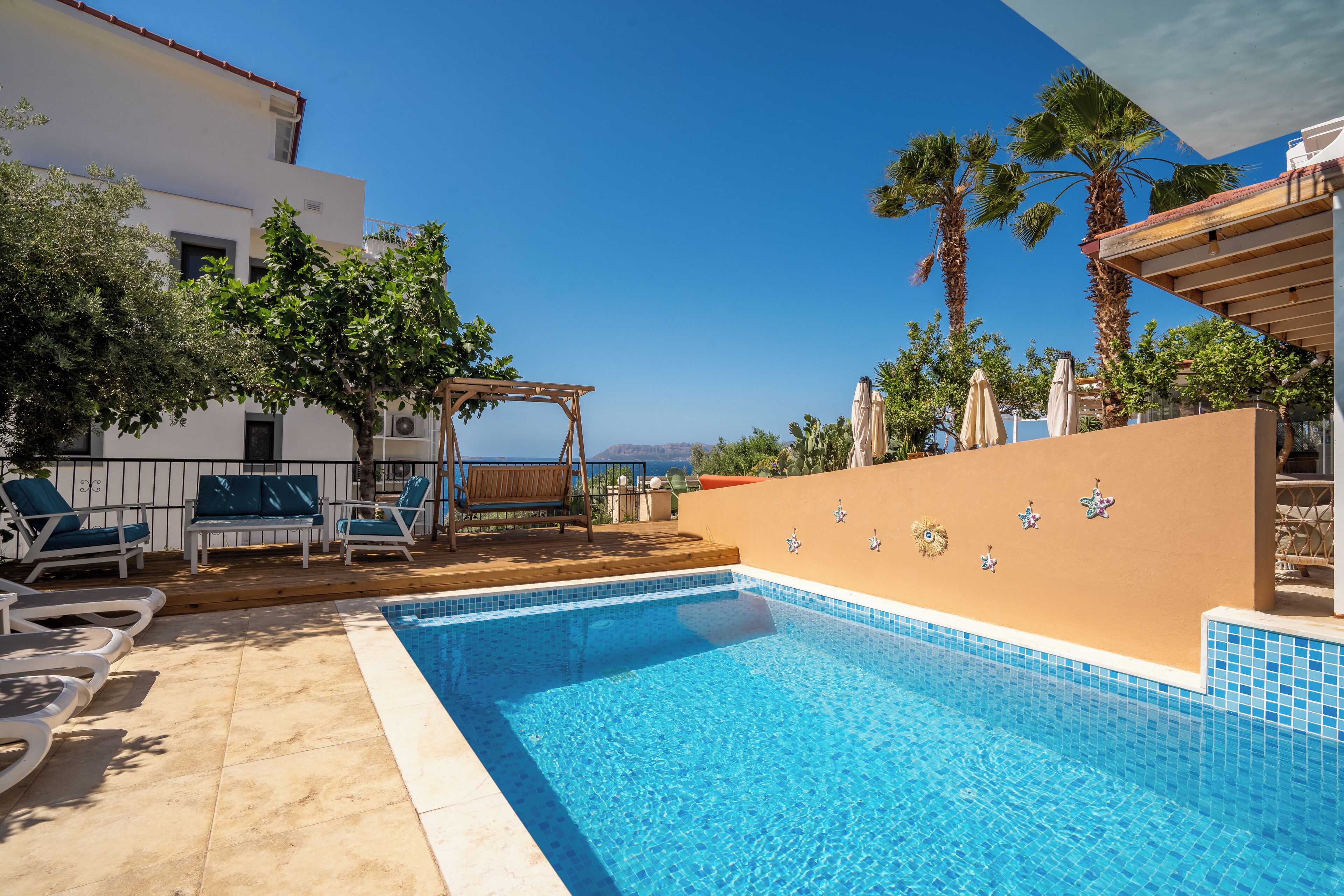 seasonal outdoor pool, pool umbrellas, pool loungers