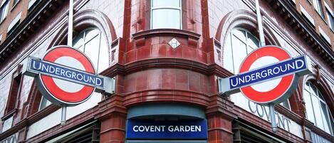 A building with two 'Underground' signs and a 'Covent Garden' sign.