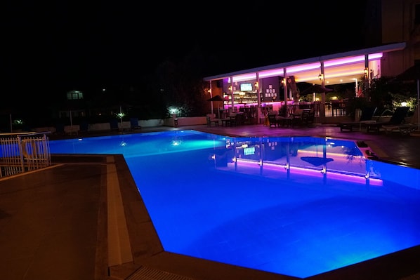 Seasonal outdoor pool, pool umbrellas, pool loungers