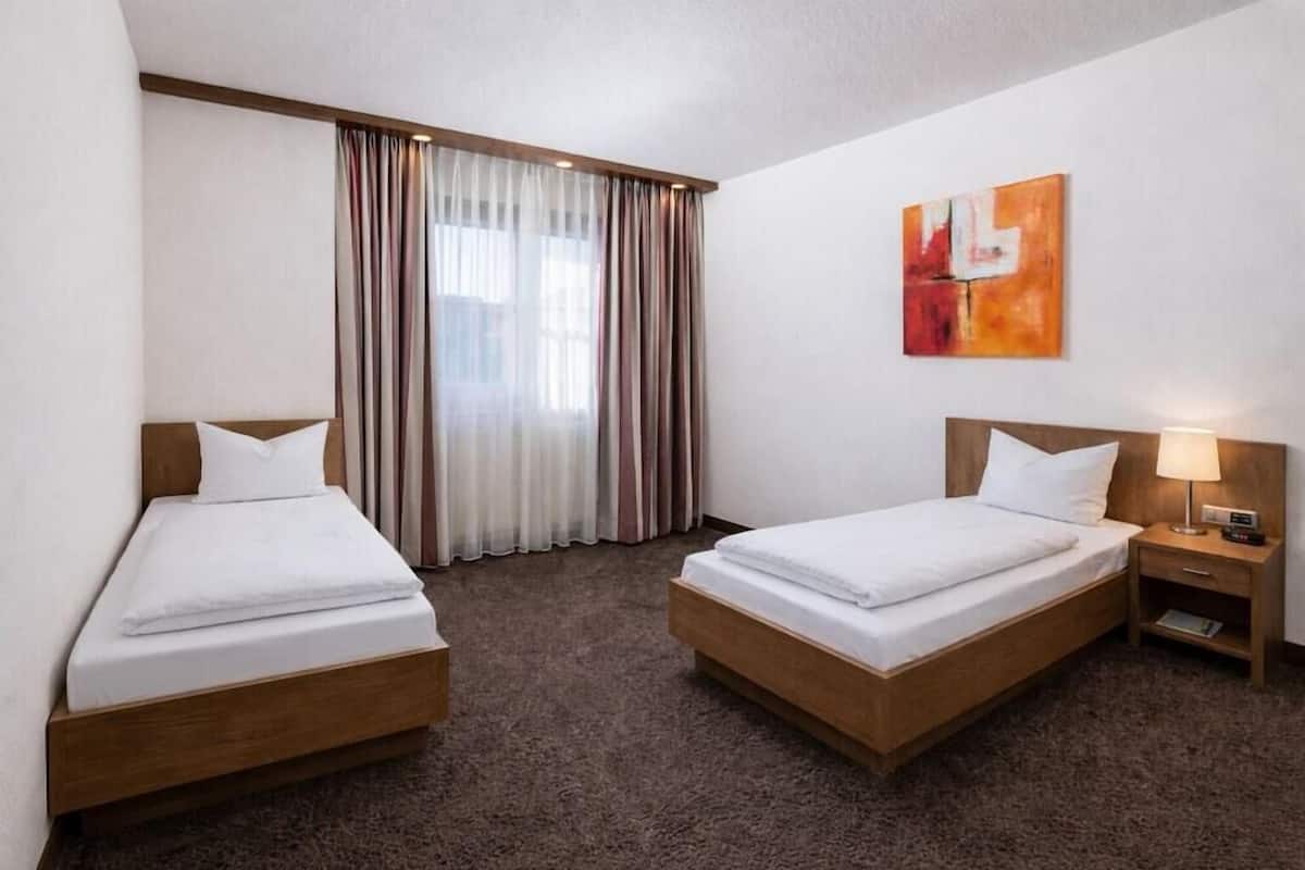 Hypo-allergenic bedding, in-room safe, desk, laptop workspace