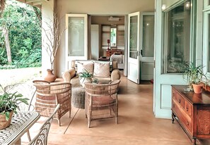 Comfort Cottage | Living area | 28-inch TV with satellite channels, Netflix, streaming services - Ngoye Lodge (eMthunzini)