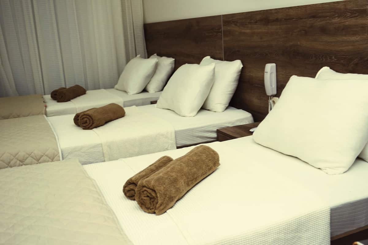Deluxe Triple Room | Premium bedding, minibar, in-room safe, iron/ironing board