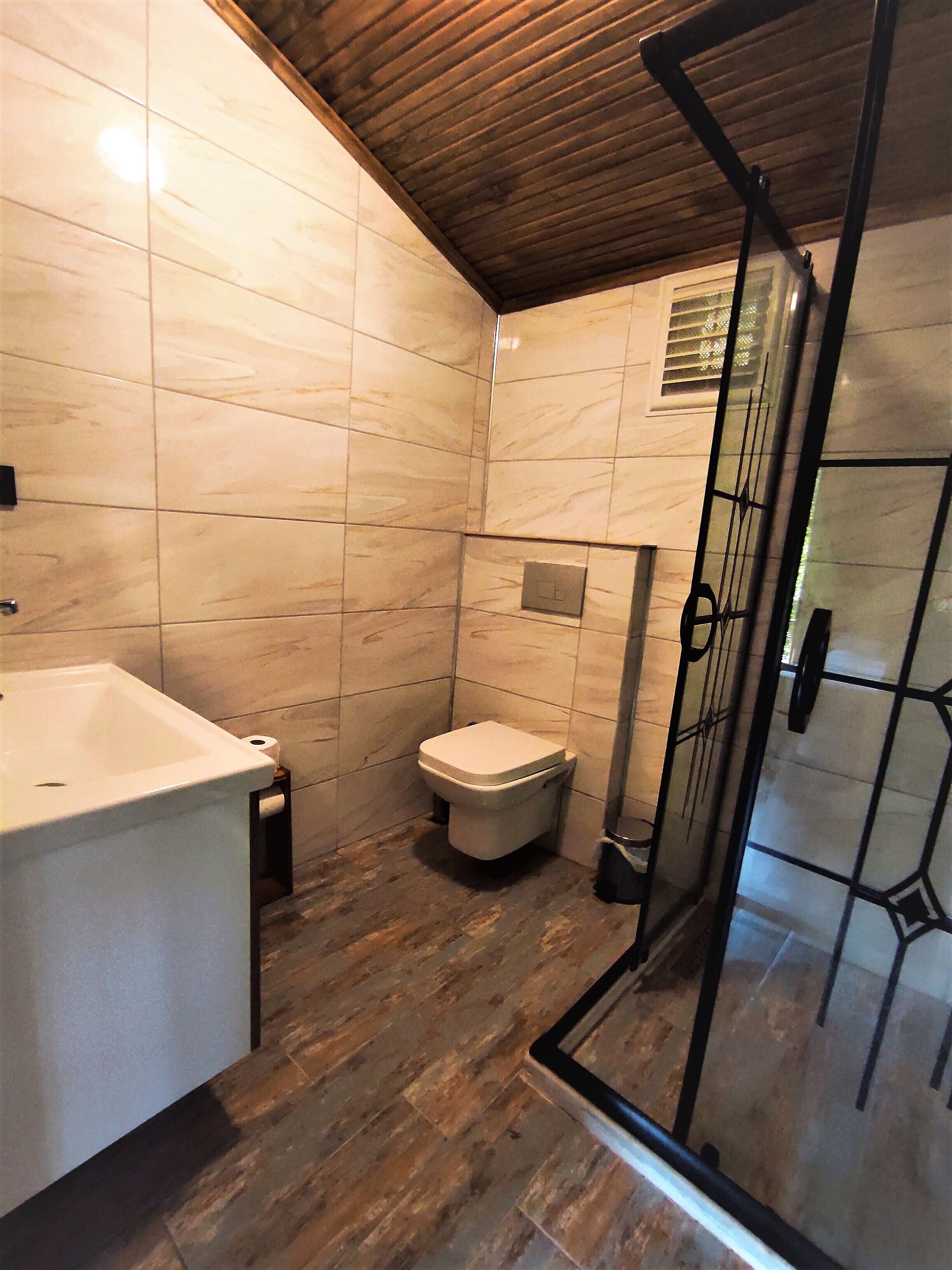 romantic chalet | bathroom | shower, free toiletries, hair dryer, slippers
