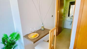 Desk, laptop workspace, blackout drapes, cribs/infant beds