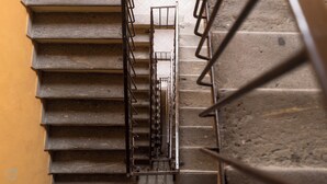 A set of metal stairs with a handrail, leading to a higher level. - Italianway   - Bligny 39 (Milan)