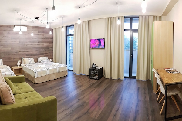 Deluxe Room | Living room | Plasma TV