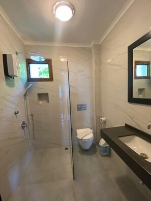 Family Apartment, 1 Bedroom | Bathroom | Shower, hair dryer, slippers, towels - Kilim Apart Hotel (Fethiye)