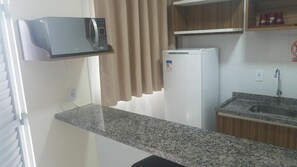 Fridge, microwave, cookware/dishes/utensils