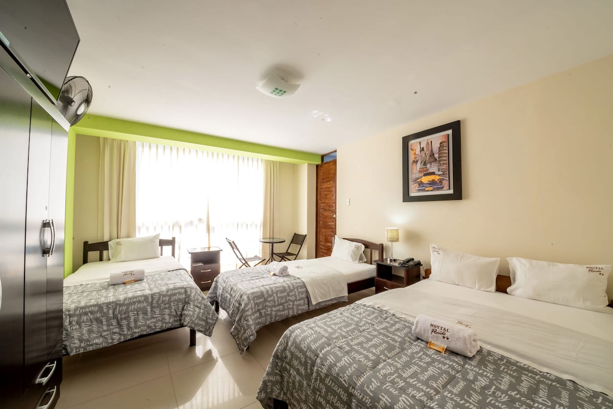 Triple Room | Desk, iron/ironing board (on request), WiFi (free), bed sheets