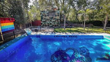 Relax by the pool at LEMON TREE, surrounded by a secure fence.