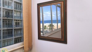 A framed picture of a balcony with a view of the beach and ocean. - MZ Apartments Prado Junior (Rio de Janeiro)