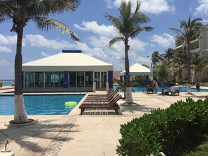Outdoor pool, open 9 AM to 7:30 PM, pool umbrellas, sun loungers