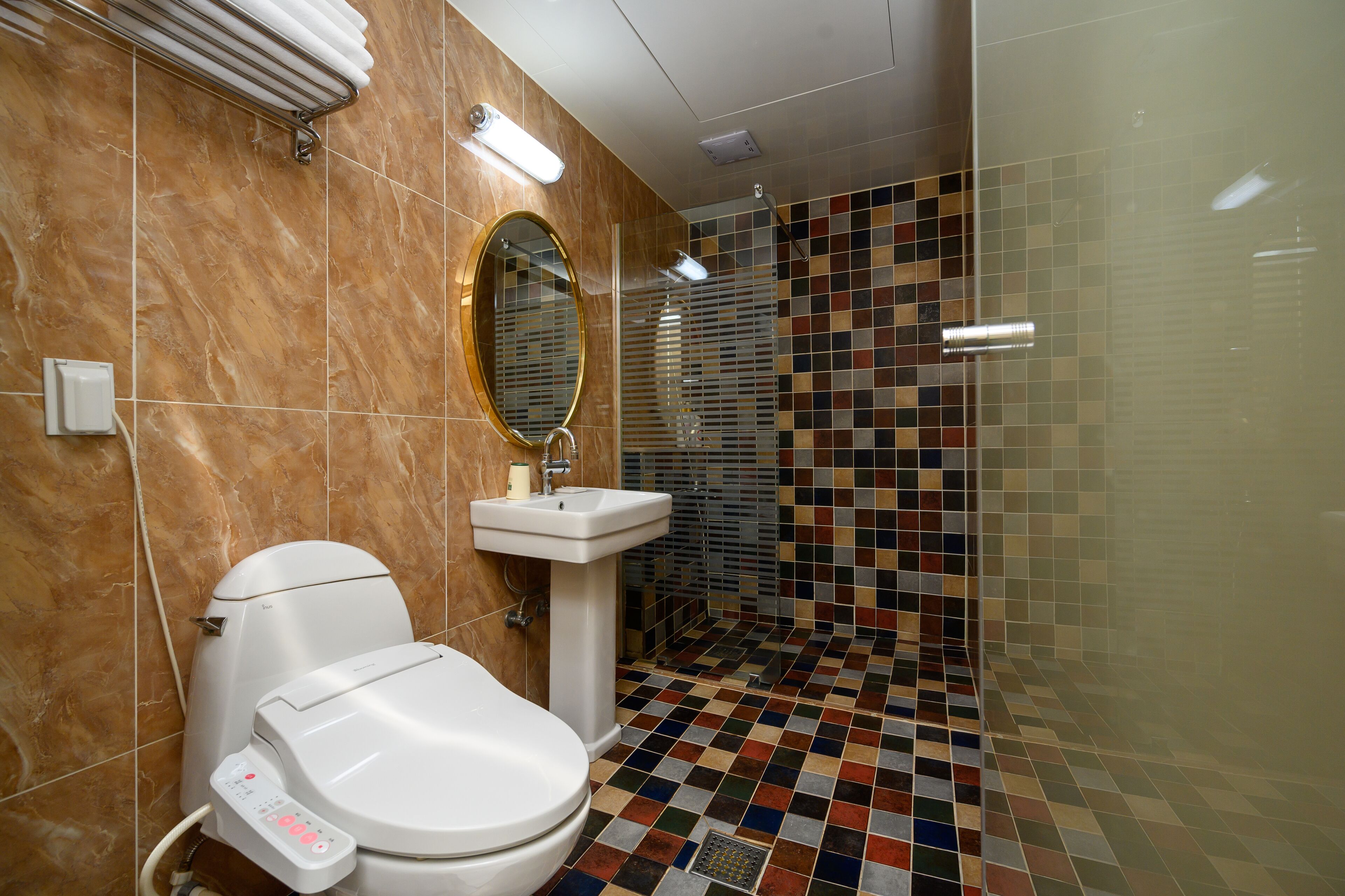 deluxe double room, 1 queen bed | bathroom | shower, free toiletries, hair dryer, slippers