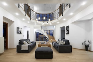 Luxury Villa, 5 Bedrooms, Partial Sea View | Living area | 65-inch flat-screen TV with satellite channels, LCD TV, fireplace - Luxury Villa Margarita (Hersonissos)