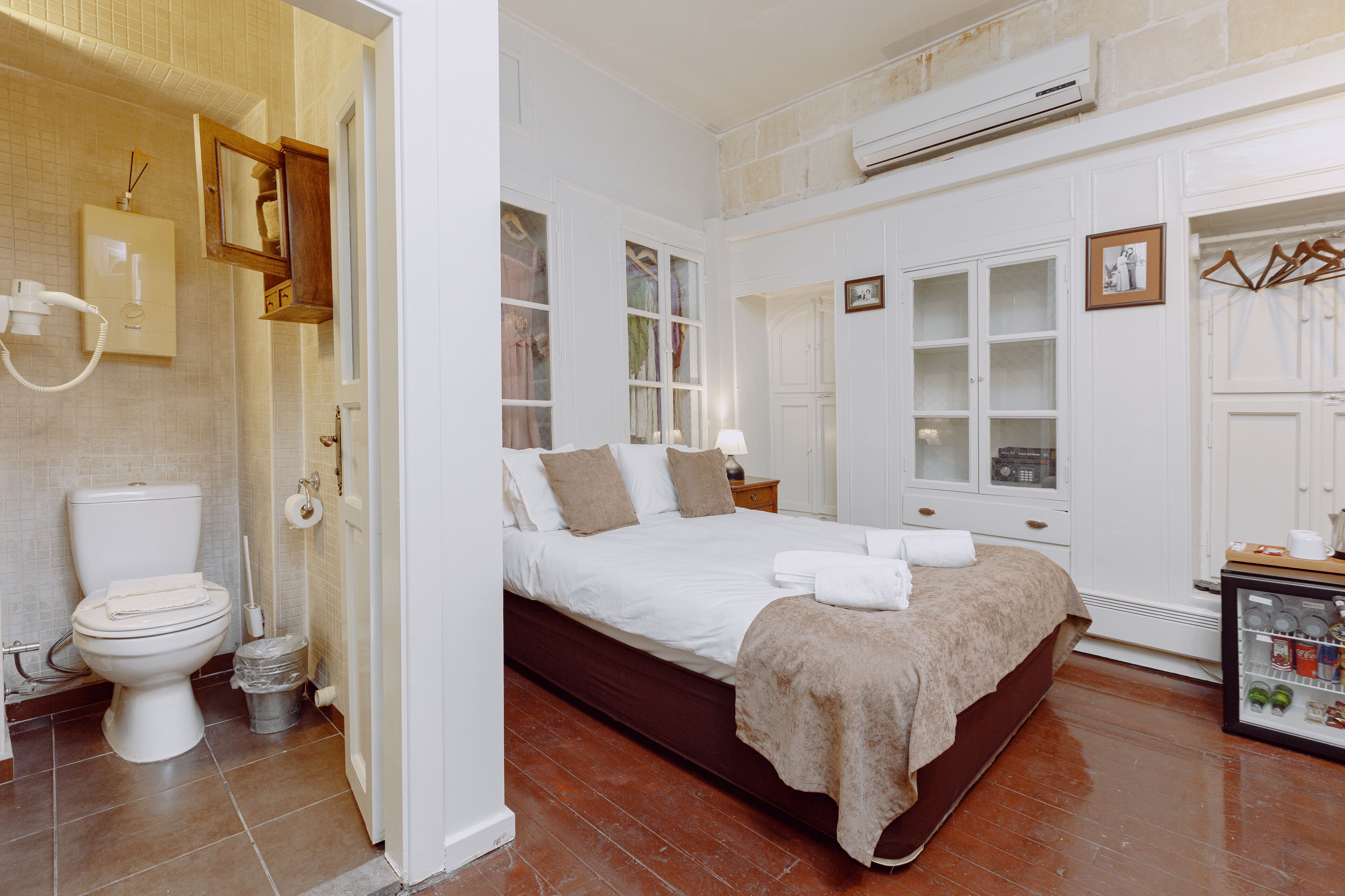 economy double room, courtyard view | 1 bedroom, minibar, in-room safe, iron/ironing board