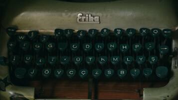 A vintage typewriter with a brand name "Erika" on the top.