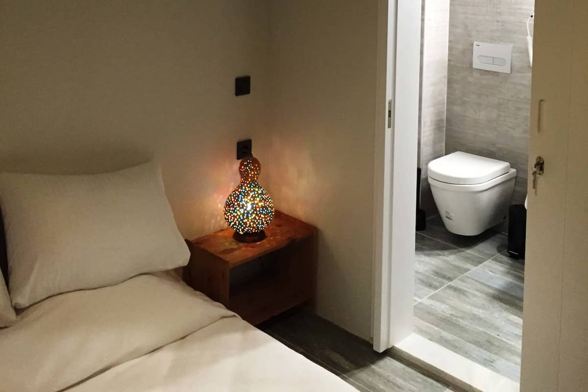 double room, pool view | living area | flat-screen tv