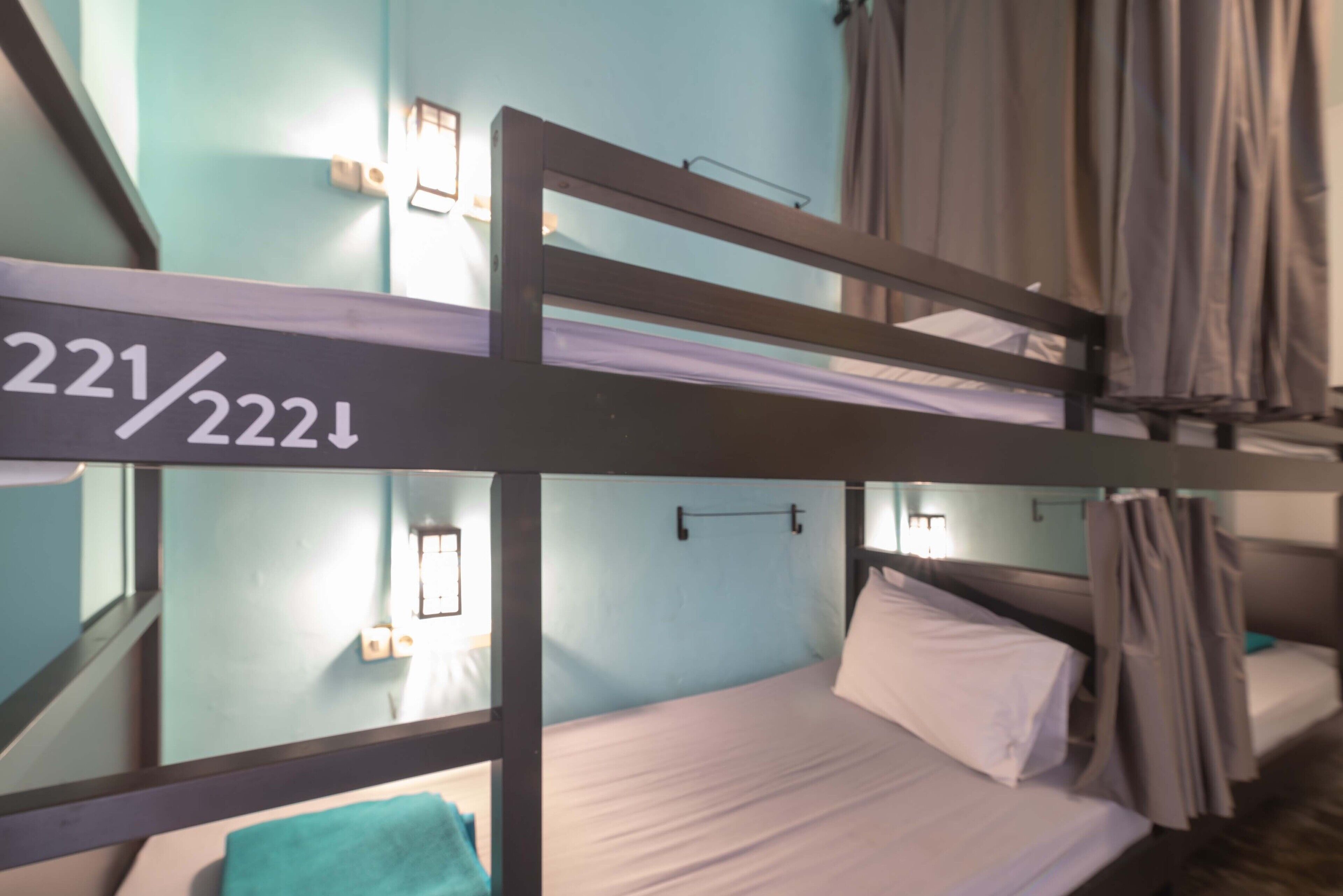 A bunk bed with a number sign above it, indicating room number 221/222.