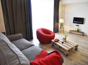 Apartment, 1 King Bed, City View | Living room | TV - Proper Apartments Tamarashvili (Tbilisi)