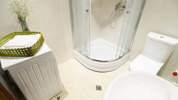 Apartment, 1 King Bed, City View | Bathroom | Shower, free toiletries, hair dryer, towels