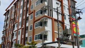 A multi-story residential building with a modern architectural design, featuring balconies and air conditioning units. - The Best Place (Samut Prakan)