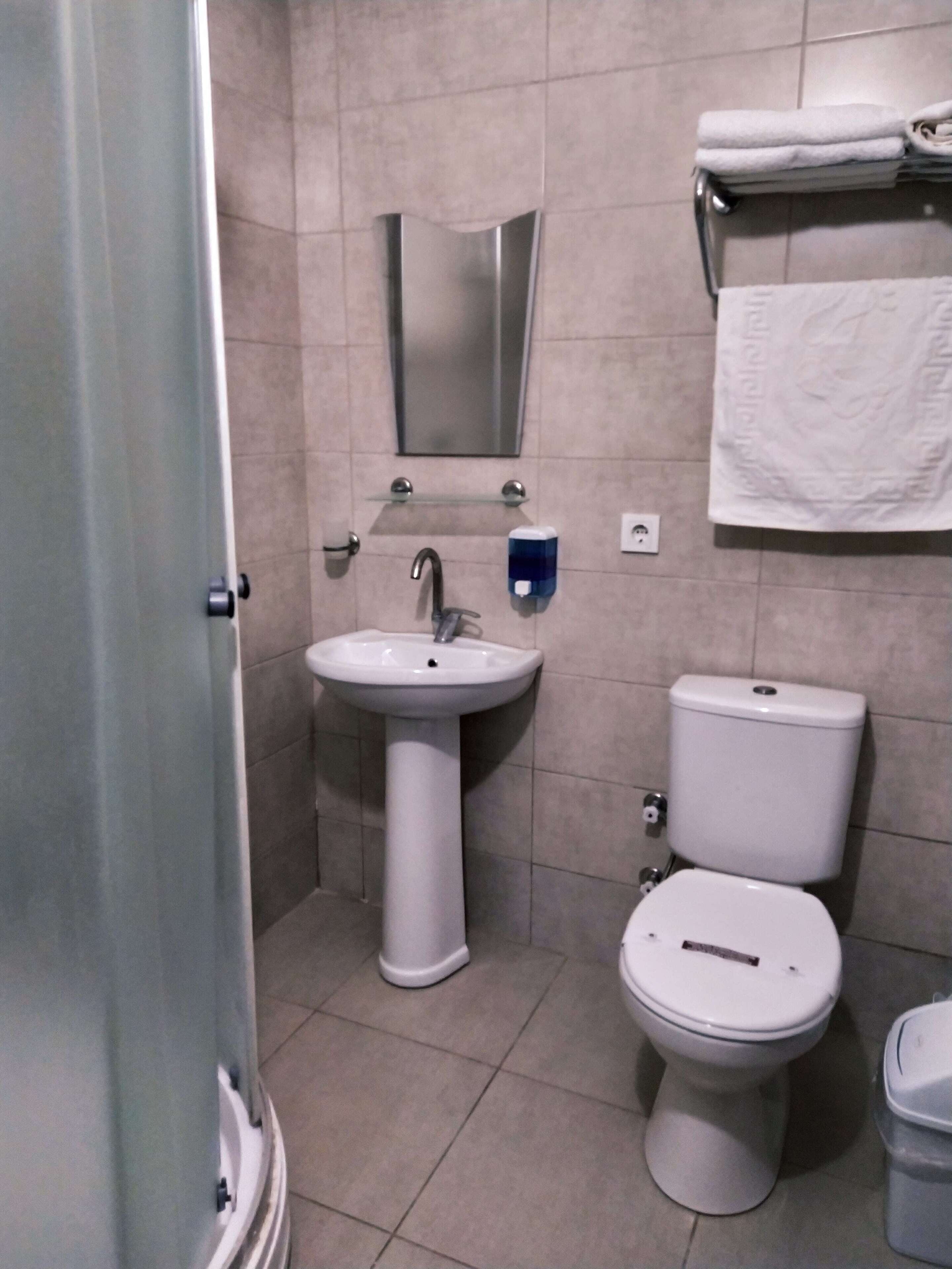 basement room | bathroom | shower, free toiletries, slippers, towels