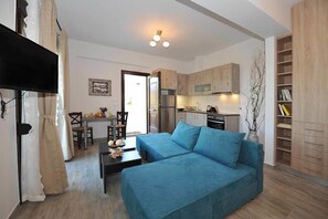 Deluxe Apartment, 1 Bedroom | Living area | 29-inch flat-screen TV with digital channels, TV - OLIVIA VILLAS (Ikaria)
