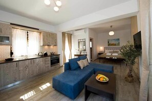Deluxe Apartment, 1 Bedroom | Living area | 29-inch flat-screen TV with digital channels, TV - OLIVIA VILLAS (Ikaria)