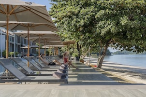 2 outdoor pools, open 8:00 AM to 7:00 PM, pool umbrellas, pool loungers