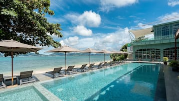 2 outdoor pools, open 8:00 AM to 7:00 PM, pool umbrellas, pool loungers