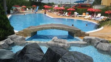 Relax by the pool surrounded by natural rock formations and enjoy the water slide.
