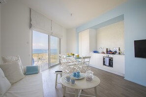 Living area | Flat-screen TV - Protaras Azure Seafront Suite (Paralimni)