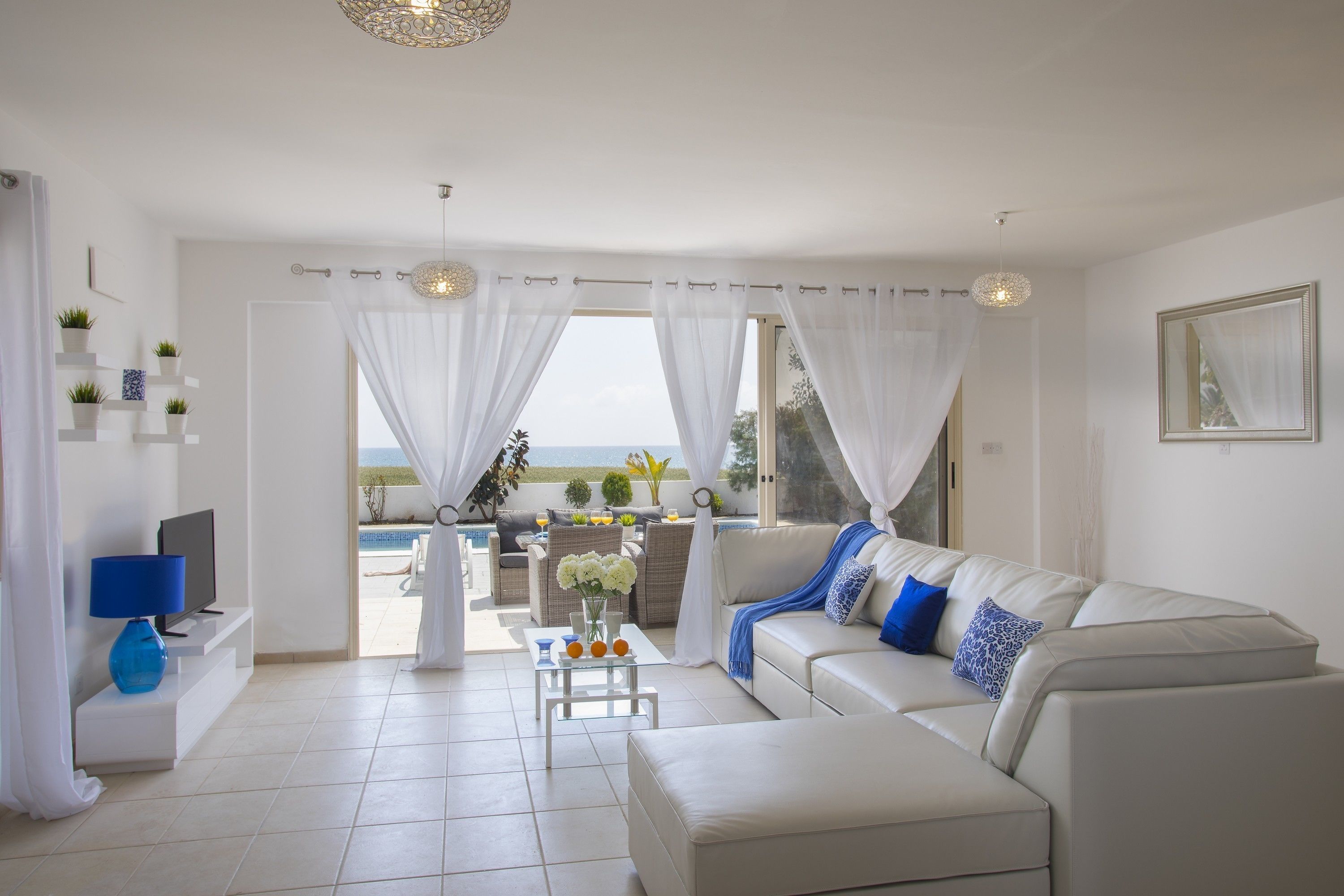Deluxe Villa, 4 Bedrooms, Beachfront | Living room | Flat-screen TV