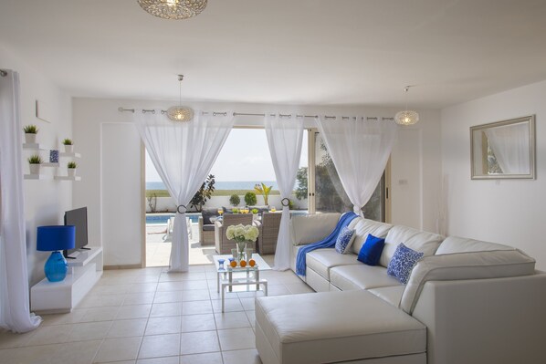 Deluxe Villa, 4 Bedrooms, Beachfront | Living room - Mazotos Villa Iris (Mazotos)
