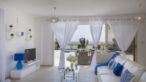 Deluxe Villa, 4 Bedrooms, Beachfront | Living room - Mazotos Villa Iris (Mazotos)