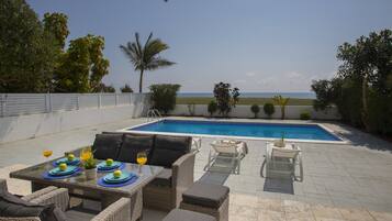 Deluxe Villa, 4 Bedrooms, Beachfront | Teres/patio