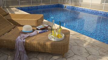 Outdoor pool, pool umbrellas, sun loungers