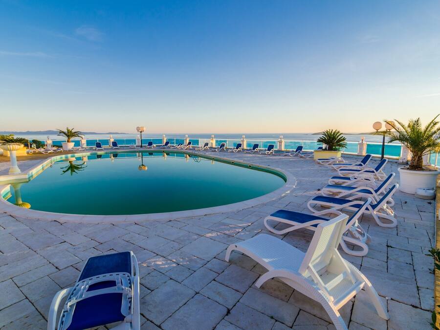Suite (Two Bedroom Suite with Balcony and Ga) | Pool | Outdoor pool, pool umbrellas, pool loungers