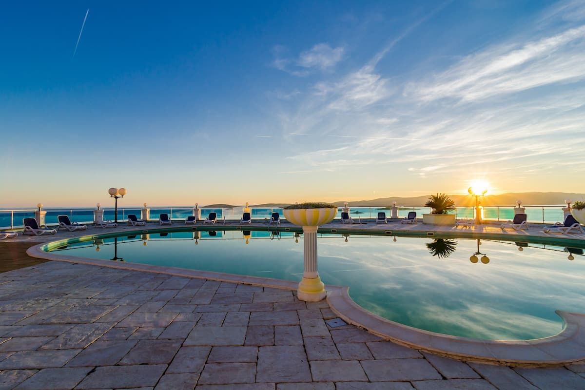 Outdoor pool, pool umbrellas, pool loungers