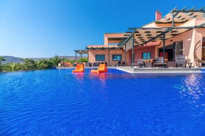 Seasonal outdoor pool, an infinity pool, sun loungers