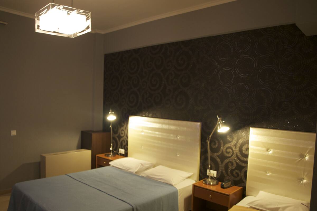 Triple Room | Minibar, in-room safe, desk, free cots/infant beds