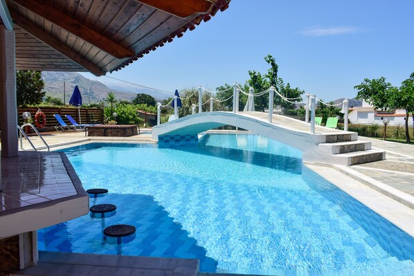 Outdoor pool, pool umbrellas, pool loungers