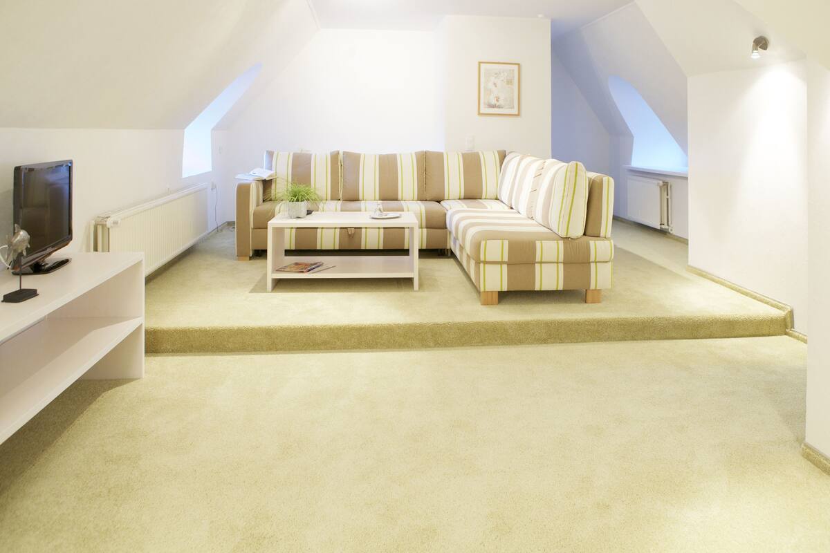 suite | living area | flat-screen tv