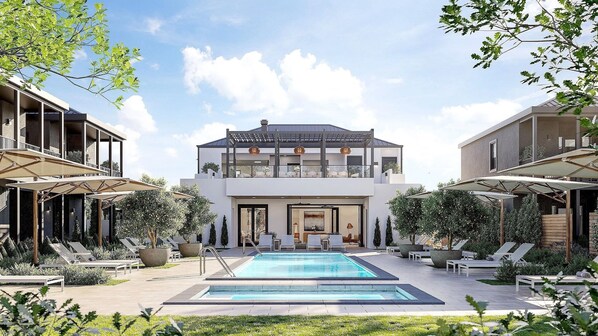 Una piscina al aire libre, sillones reclinables de piscina