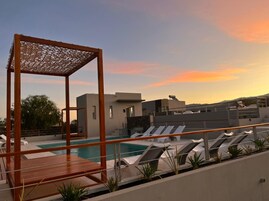 Seasonal outdoor pool, open 10:00 AM to 8:00 PM, pool umbrellas