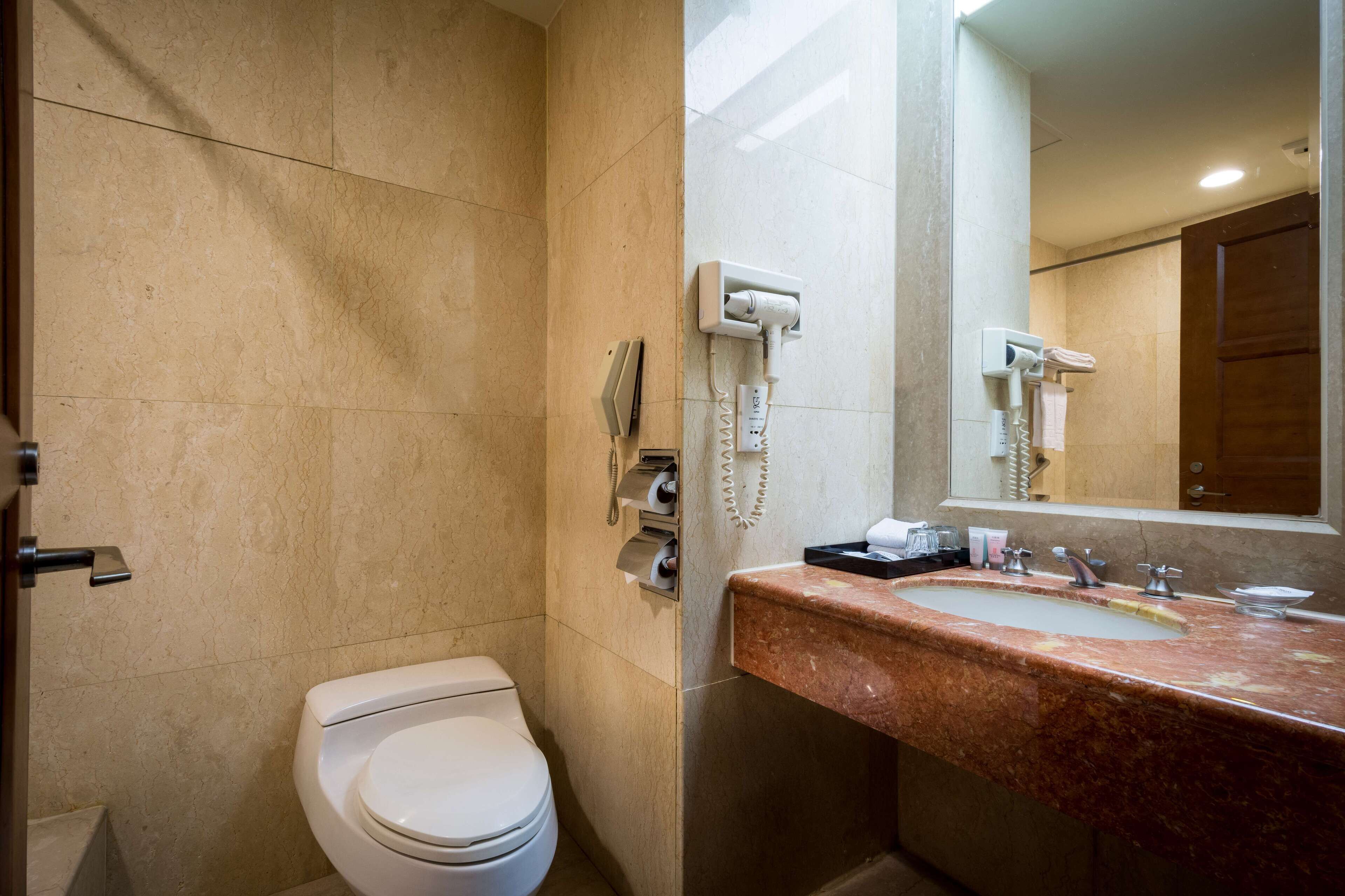 rainfall showerhead, eco-friendly toiletries, hair dryer, slippers