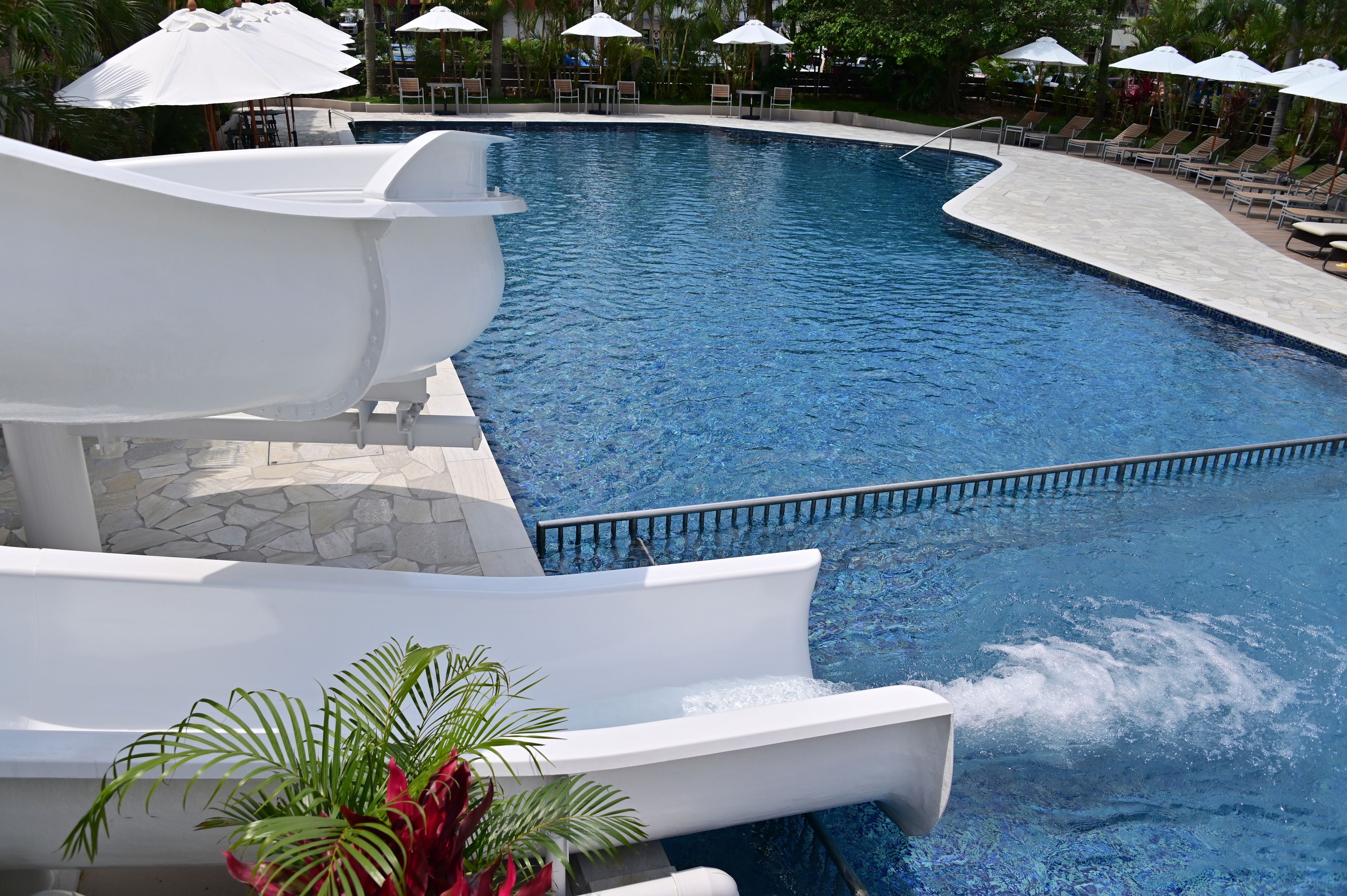 seasonal outdoor pool, open 9:30 am to 5:00 pm, pool umbrellas