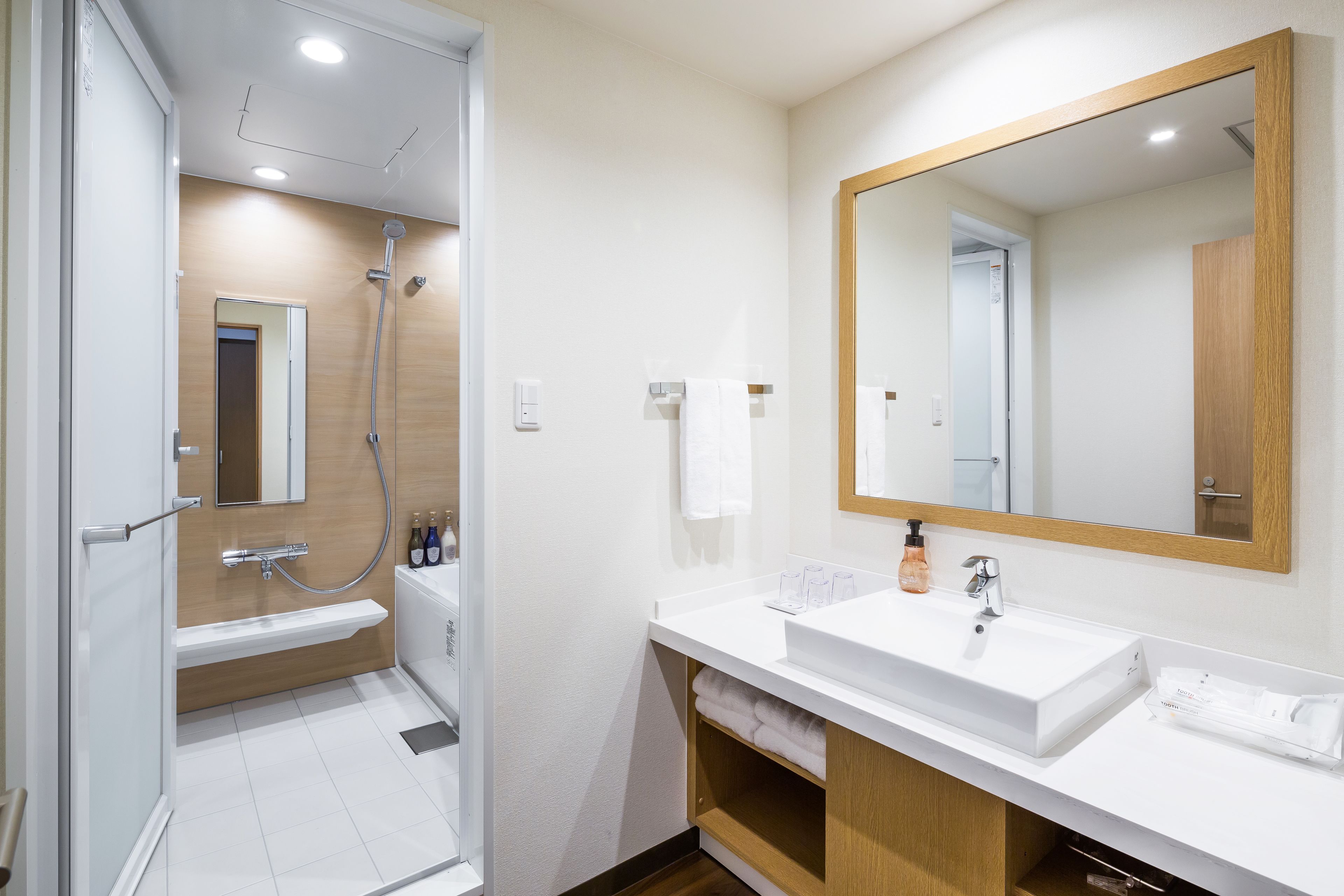 deluxe quadruple room (4 twin beds) | bathroom | separate bathtub and shower, deep-soaking bathtub, free toiletries