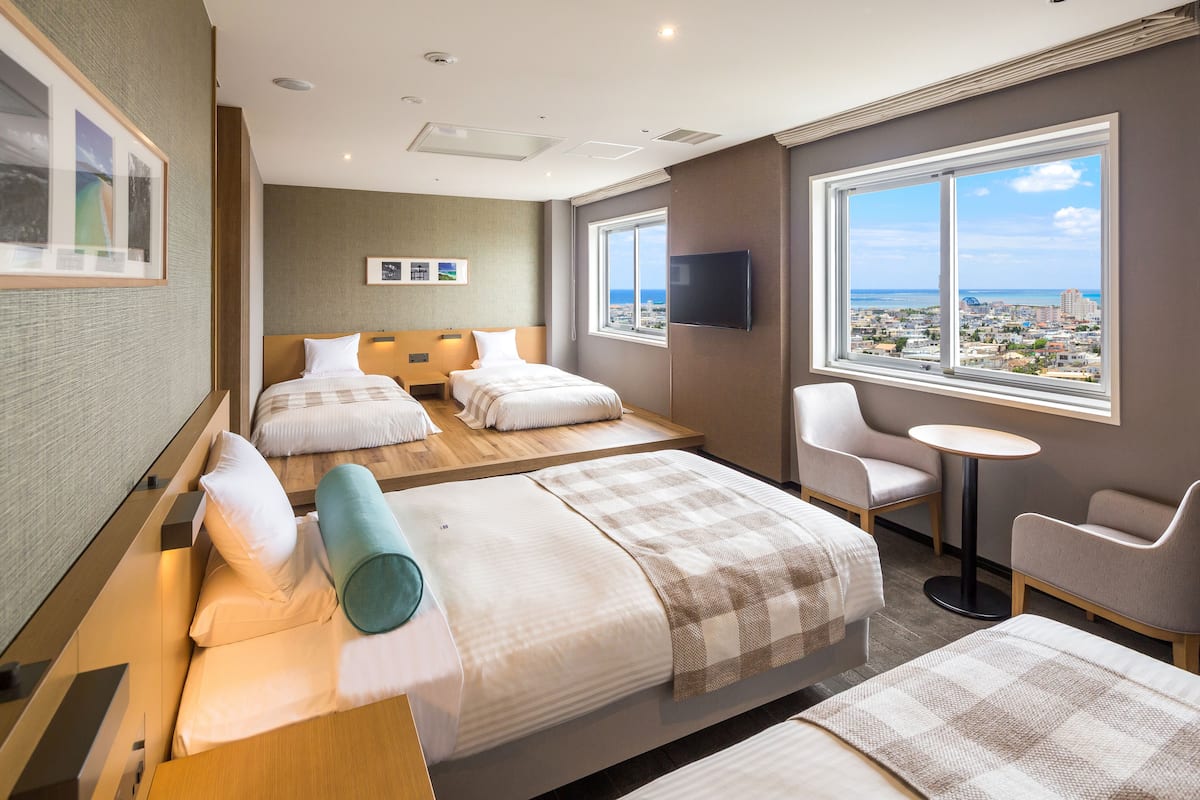 deluxe quadruple room, ocean view (4 twin beds) | 1 bedroom, in-room safe, iron/ironing board, free wifi